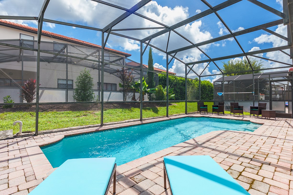Pool Area with Sun Loungers and Seating
