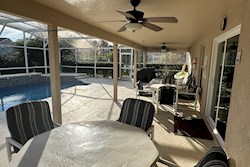 South Facing Pool with shaded seating area.