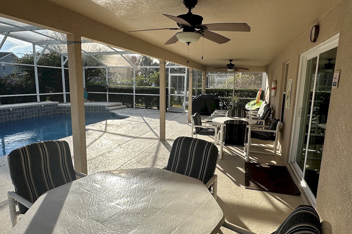 South Facing Pool with shaded seating area.