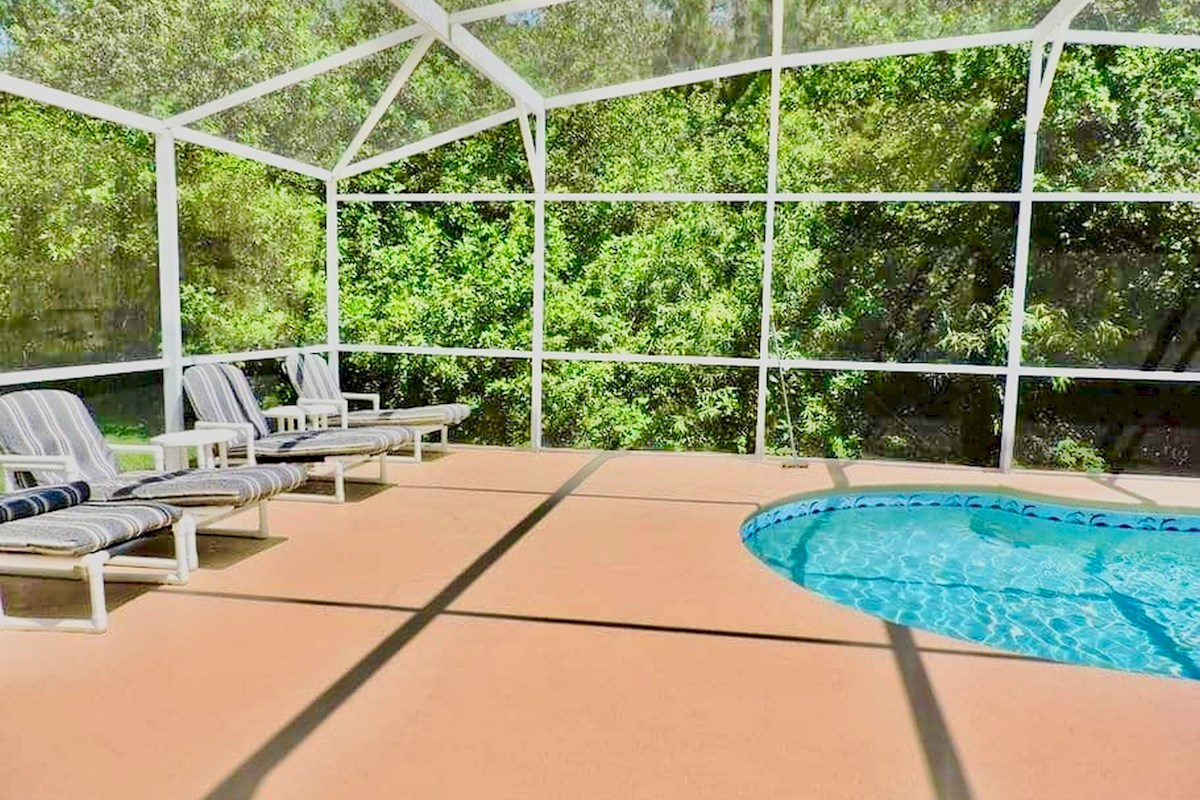 An extended deck with lots of space and loungers for sunbathing